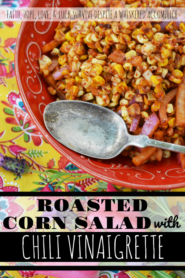 Roasted Corn Salad with Chile Vinaigrette - The perfect picnic or cookout side dish is one that is not only super flavorful but one that can hold its own against high summer temperatures. This incredible summer roasted corn salad has just the right amount of smokey chile flavor with just a touch of sweetness to help balance everything out and is also safe to serve on even the hottest summer day.