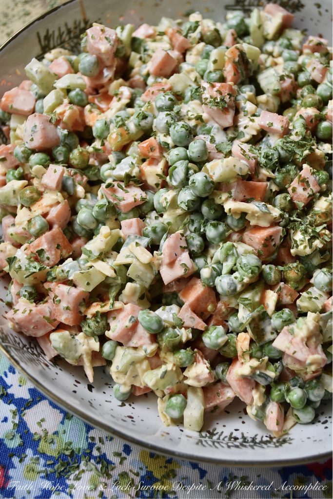 Crunchy Pea Salad with Creamy Buffalo Sauce - If you're a crunchy food superfan, this is one side salad you're definitely going to want to try this summer. Diced celery and carrots give an amazing crunch to this cheesy pea salad. And, once you add in a creamy homemade buffalo sauce made with hot sauce, honey, sour cream, and a few other ingredients, I think that you'll find this pea salad has just as much flavor as it does crunch.