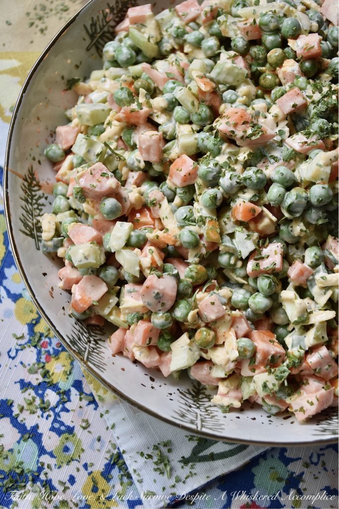 Crunchy Pea Salad with Creamy Buffalo Sauce - If you're a crunchy food superfan, this is one side salad you're definitely going to want to try this summer. Diced celery and carrots give an amazing crunch to this cheesy pea salad. And, once you add in a creamy homemade buffalo sauce made with hot sauce, honey, sour cream, and a few other ingredients, I think that you'll find this pea salad has just as much flavor as it does crunch.