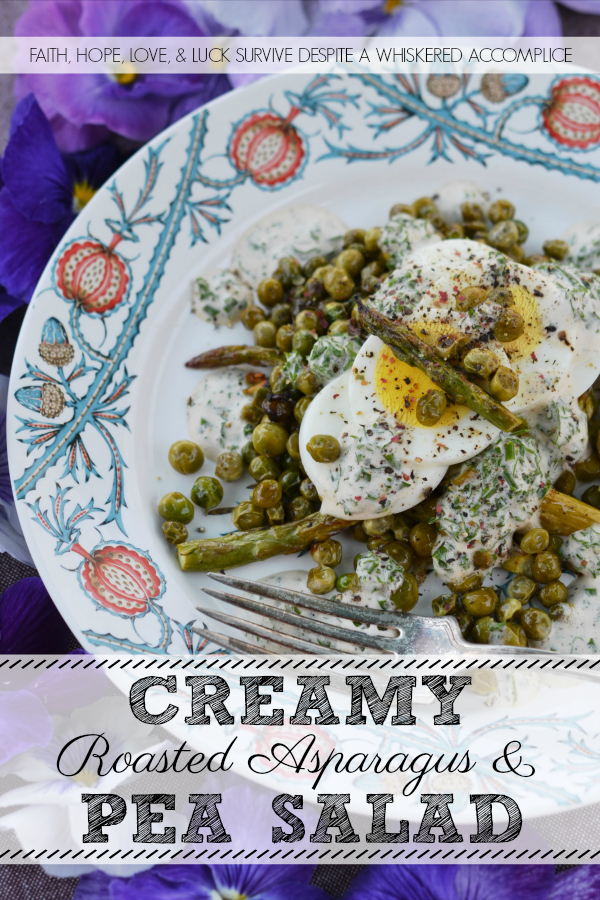 Creamy Roasted Asparagus & Pea Salad - This warm roasted vegetable salad uses fresh asparagus, frozen peas, and garlic to create an absolutely unforgettable spring salad. Topped with sliced hard-boiled eggs and a creamy parsley and chive dressing, this salad is anything but boring.