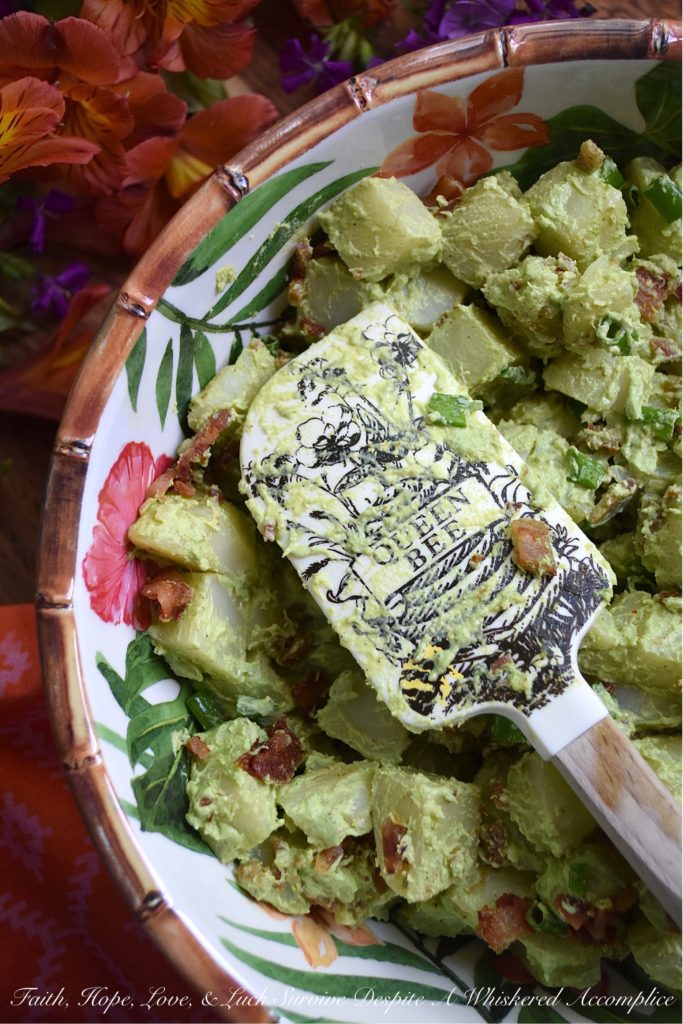 Sour Cream & Scallion Potato Salad with Bacon - This flavorful potato salad gets its vibrant green color from three bunches of chopped and blended scallions. Add in a dressing made with both sour cream and mayonnaise, as well as a healthy dose of crispy crumbled bacon, and you've got a potato salad your entire family will swoon over. If you're searching for a new and unique potato salad recipe, that's just a little bit different than your everyday recipe, this is definitely it.