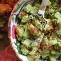 Sour Cream & Scallion Potato Salad with Bacon - This flavorful potato salad gets its vibrant green color from three bunches of chopped and blended scallions. Add in a dressing made with both sour cream and mayonnaise, as well as a healthy dose of crispy crumbled bacon, and you've got a potato salad your entire family will swoon over. If you're searching for a new and unique potato salad recipe, that's just a little bit different than your everyday recipe, this is definitely it.