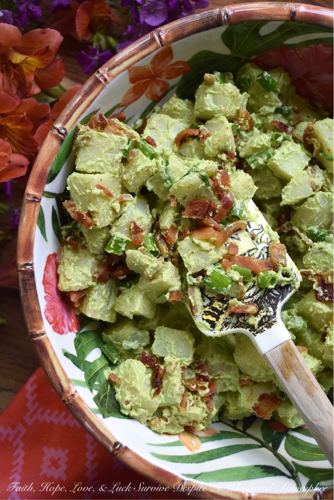 Sour Cream & Scallion Potato Salad with Bacon - This flavorful potato salad gets its vibrant green color from three bunches of chopped and blended scallions. Add in a dressing made with both sour cream and mayonnaise, as well as a healthy dose of crispy crumbled bacon, and you've got a potato salad your entire family will swoon over. If you're searching for a new and unique potato salad recipe, that's just a little bit different than your everyday recipe, this is definitely it.