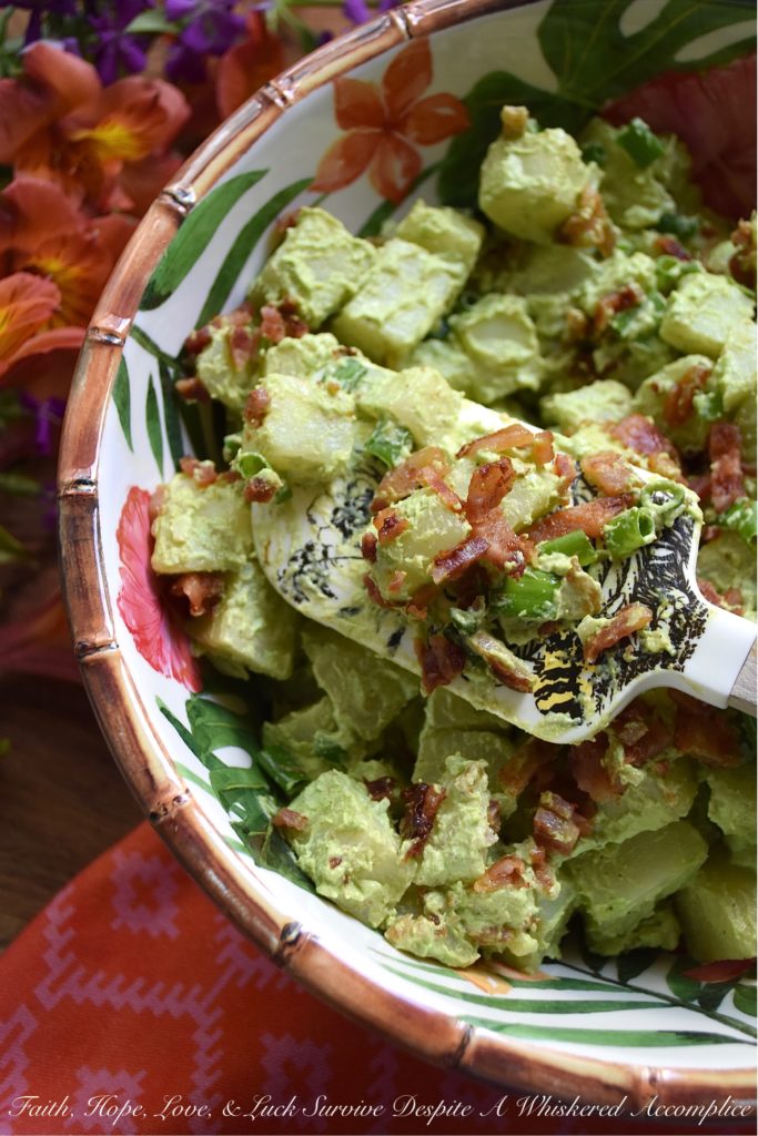 Sour Cream & Scallion Potato Salad with Bacon - This flavorful potato salad gets its vibrant green color from three bunches of chopped and blended scallions. Add in a dressing made with both sour cream and mayonnaise, as well as a healthy dose of crispy crumbled bacon, and you've got a potato salad your entire family will swoon over. If you're searching for a new and unique potato salad recipe, that's just a little bit different than your everyday recipe, this is definitely it.