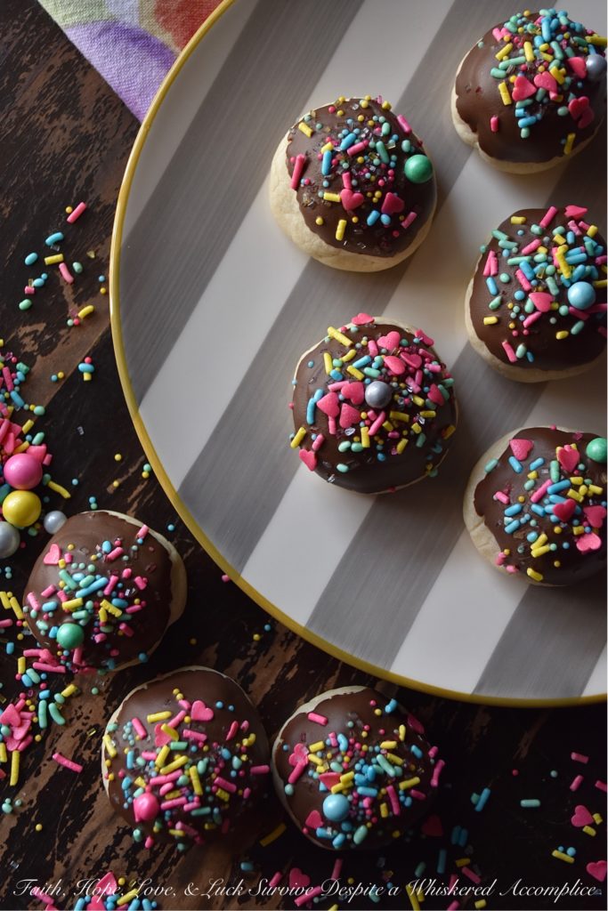 Chocolate-Covered Cherry Bon Bon Cookies - These heavenly chocolate-covered bon bon cookies are filled with a sweet surprise. Tucked inside each one is a maraschino cherry, just waiting for you to discover it. And, after each cookie is dipped in melted dark chocolate and topped generously with sprinkles, I think you'll agree that these amazing cookies are pretty hard to resist.