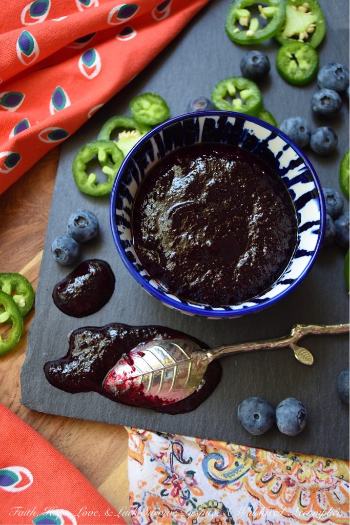 Blueberry & Jalapeño Fruit Butter Spread - Y'all, fruit butter is definitely where it's at. Unlike most jams, jellies, or preserves, it has a unique texture. It's not smooth and it's not chunky, instead, it's somewhere in between. And when you balance out the sweetness of this particular fruit butter with spicy jalapeños, it becomes something almost magical. Your mouth is gonna do a happy dance no matter what you choose to slather this fresh blueberry fruit butter spread on. Although, I personally, suggest a biscuit, English muffin, or crumbly piece of cornbread.