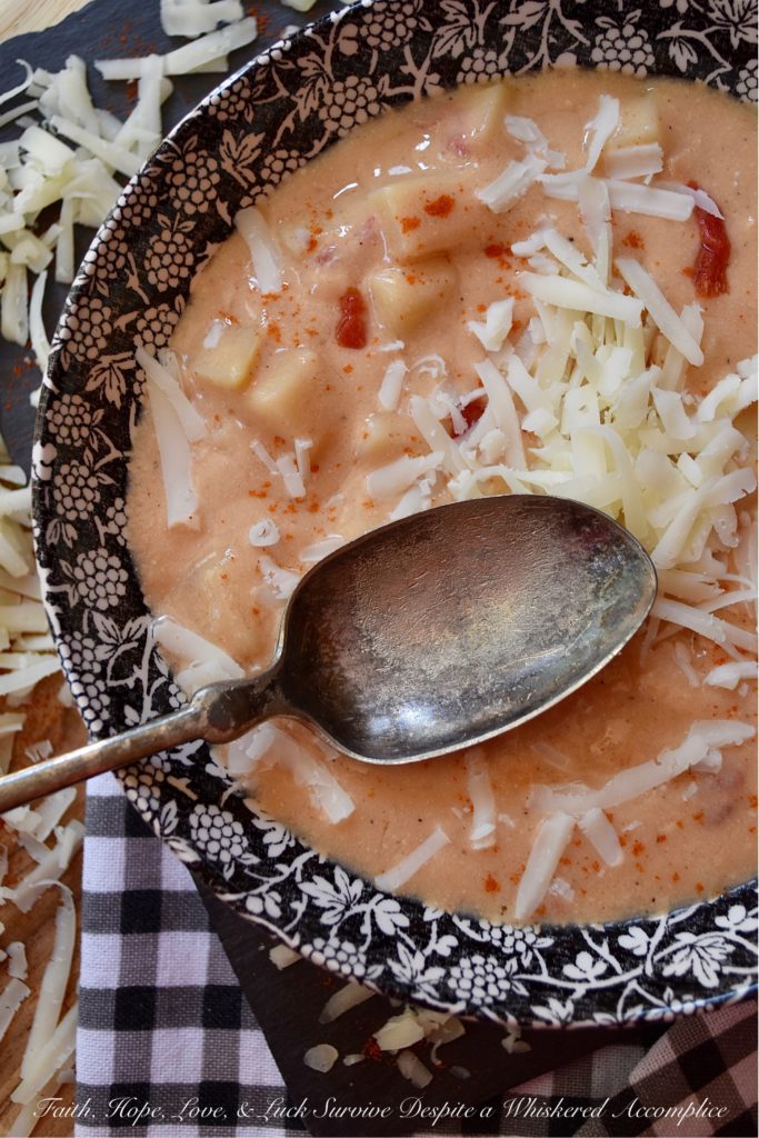 Southern Pimento Cheese Crockpot Potato Soup - If you're looking for a quick southern-inspired, easy-to-make, weekday bowl of creamy potato soup, then this is your recipe. Simply dump the soup ingredients into a crockpot and stir to combine. Eight hours later, purée half of the soup in a blender and then garnish each bowl of pimento cheese potato soup with some freshly grated white cheddar cheese right before serving. What could be more simple, or more delicious?