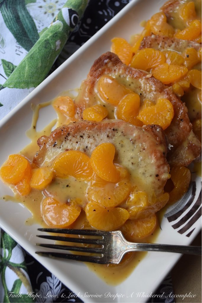 Mandarin Orange Honey Mustard Pork Chops - This may be one of the easiest fried pork chop recipes in the world. A little bit of salt and pepper, a quick flour dredge, and then a quick and easy pan fry in olive oil makes these pork chops the perfect option for a busy weeknight meal. And, once they are topped with a delicious mandarin orange honey mustard sauce, your mouth and your stomach are going to totally fall in love.
