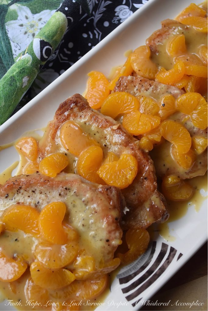 Mandarin Orange Honey Mustard Pork Chops - This may be one of the easiest fried pork chop recipes in the world. A little bit of salt and pepper, a quick flour dredge, and then a quick and easy pan fry in olive oil makes these pork chops the perfect option for a busy weeknight meal. And, once they are topped with a delicious mandarin orange honey mustard sauce, your mouth and your stomach are going to totally fall in love.