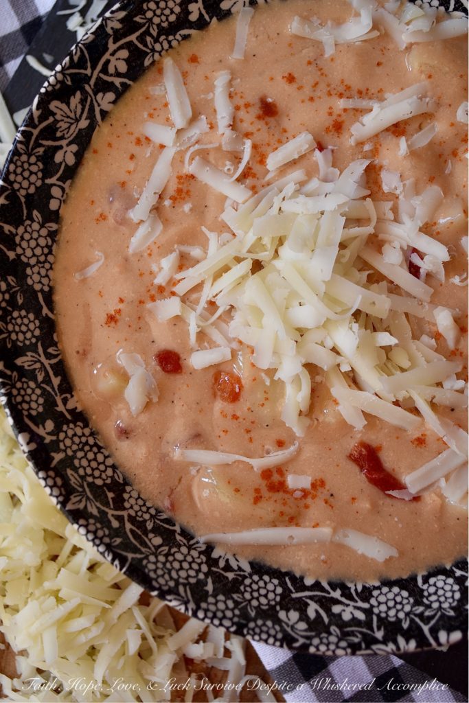 Southern Pimento Cheese Crockpot Potato Soup - If you're looking for a quick southern-inspired, easy-to-make, weekday bowl of creamy potato soup, then this is your recipe. Simply dump the soup ingredients into a crockpot and stir to combine. Eight hours later, purée half of the soup in a blender and then garnish each bowl of pimento cheese potato soup with some freshly grated white cheddar cheese right before serving. What could be more simple, or more delicious?