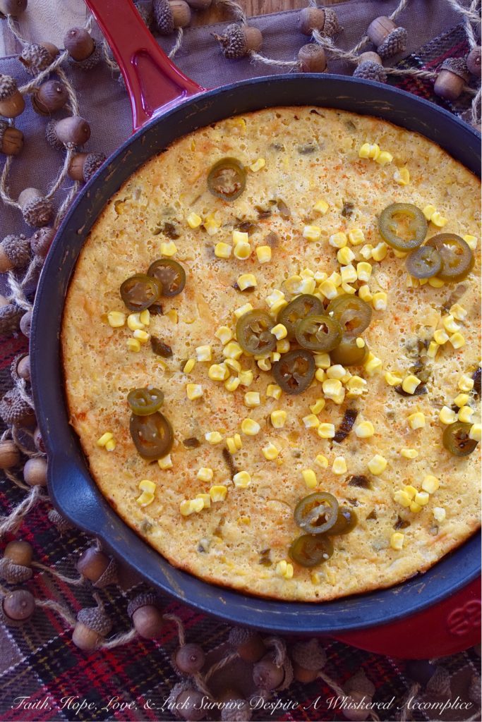 Sweet Pickled Jalapeño Cornbread Casserole - Looking for a side dish that is filling, sweet and spicy, and goes with just about everything? Well, this is definitely it. This oven-baked cast iron skillet casserole is overflowing with corn, onions, jalapeños, and just the right amount of cream cheese and cheddar. It's not too dry and not too wet; the perfect marriage between a traditional skillet cornbread and a cheesy corn casserole.