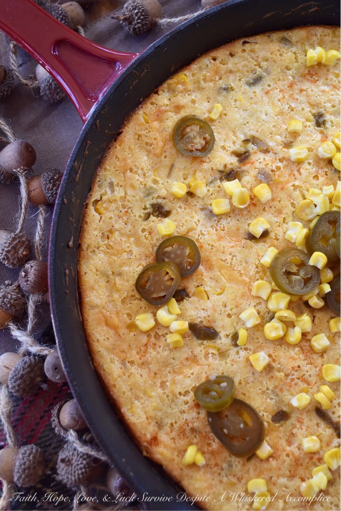 Sweet Pickled Jalapeño Cornbread Casserole - Looking for a side dish that is filling, sweet and spicy, and goes with just about everything? Well, this is definitely it. This oven-baked cast iron skillet casserole is overflowing with corn, onions, jalapeños, and just the right amount of cream cheese and cheddar. It's not too dry and not too wet; the perfect marriage between a traditional skillet cornbread and a cheesy corn casserole.