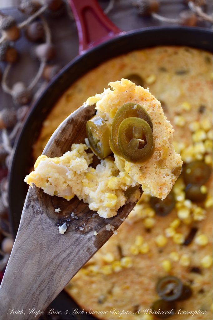 Sweet Pickled Jalapeño Cornbread Casserole - Looking for a side dish that is filling, sweet and spicy, and goes with just about everything? Well, this is definitely it. This oven-baked cast iron skillet casserole is overflowing with corn, onions, jalapeños, and just the right amount of cream cheese and cheddar. It's not too dry and not too wet; the perfect marriage between a traditional skillet cornbread and a cheesy corn casserole.
