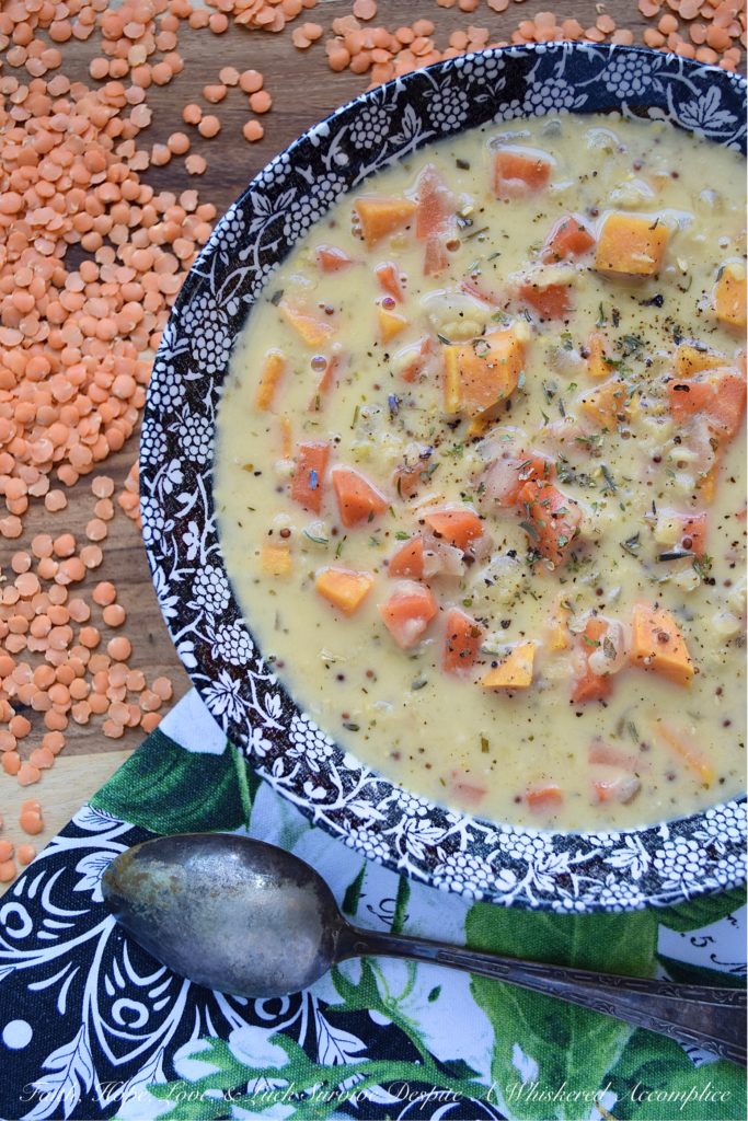Creamy French Red Lentil Soup with Ham Stock - Instead of tossing out your leftover holiday ham bone, why not use it to make this creamy red lentil soup instead? After all, why should you waste all of that delicious salty ham flavor, when you can use it to make this red lentil, carrot, and sweet potato soup, seasoned with Herbes de Provence? This French-inspired red lentil soup is bound to become an after-the-holiday new family favorite recipe.