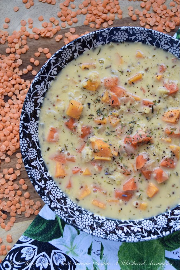 Creamy French Red Lentil Soup with Ham Stock - Instead of tossing out your leftover holiday ham bone, why not use it to make this creamy red lentil soup instead? After all, why should you waste all of that delicious salty ham flavor, when you can use it to make this red lentil, carrot, and sweet potato soup, seasoned with Herbes de Provence? This French-inspired red lentil soup is bound to become an after-the-holiday new family favorite recipe.