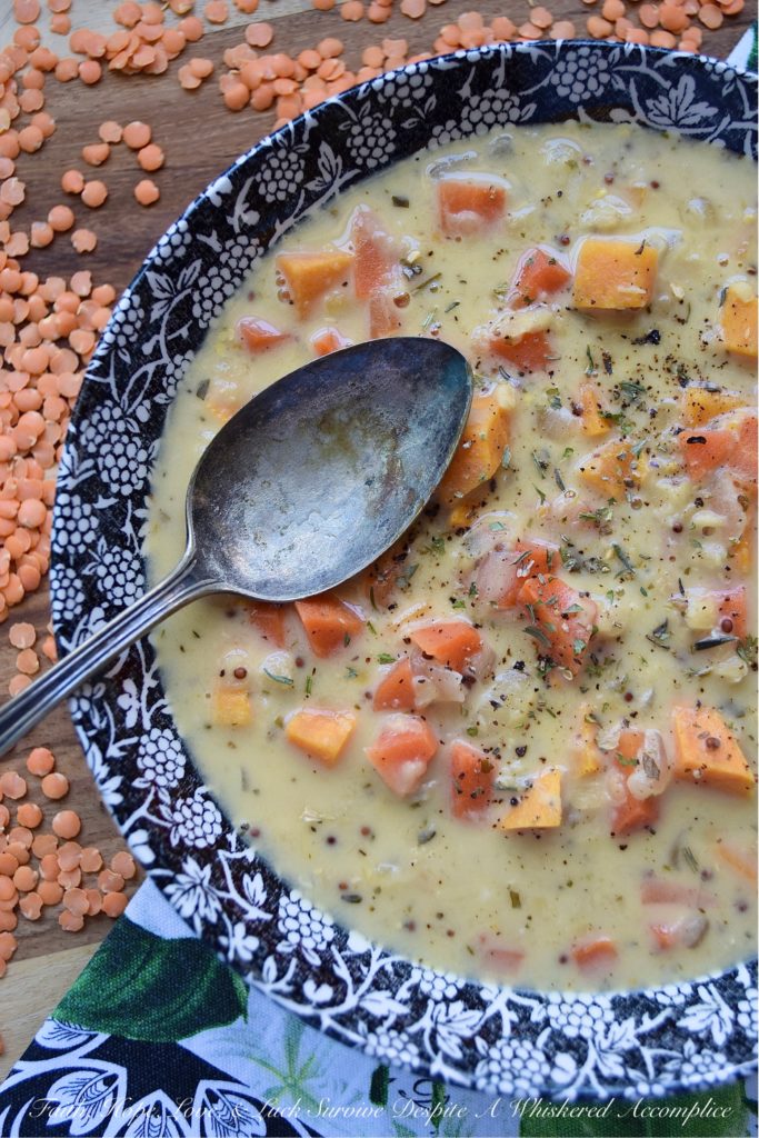 Creamy French Red Lentil Soup with Ham Stock - Instead of tossing out your leftover holiday ham bone, why not use it to make this creamy red lentil soup instead? After all, why should you waste all of that delicious salty ham flavor, when you can use it to make this red lentil, carrot, and sweet potato soup, seasoned with Herbes de Provence? This French-inspired red lentil soup is bound to become an after-the-holiday new family favorite recipe.