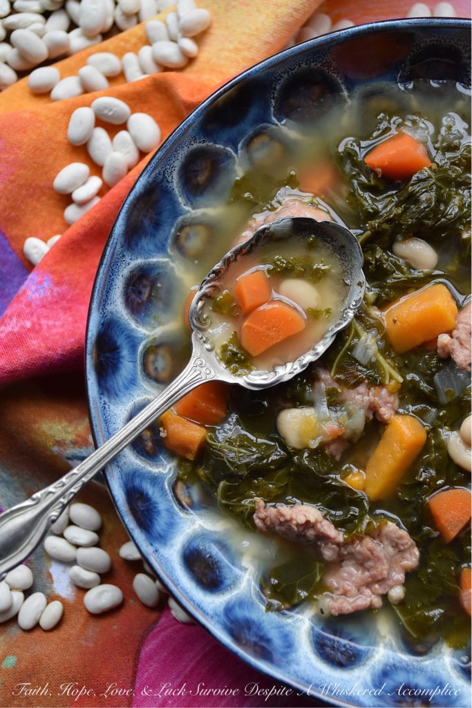 One-Pot Italian Sausage, Kale, & Bean Soup - There's nothing better than a healthy, comforting, and absolutely delicious bowl of soup on a cold winter's day. And, when you make that soup using only one pot, things get even better. This one-pot soup, made with Italian sausage, kale, & beans, will easily become one of your go-to winter soup recipes.