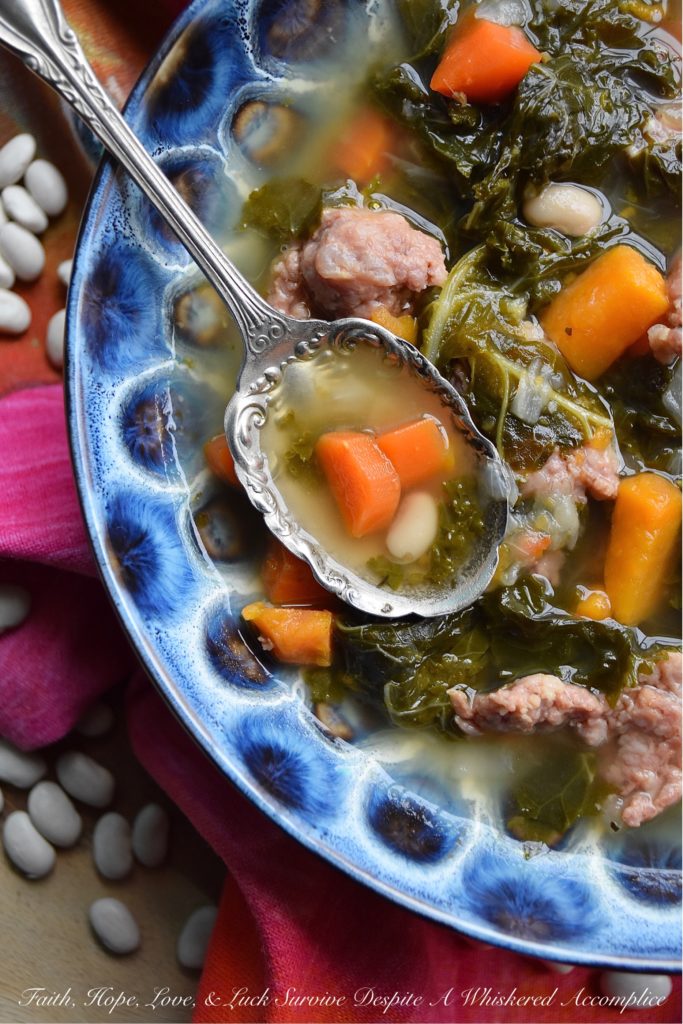 One-Pot Italian Sausage, Kale, & Bean Soup - There's nothing better than a healthy, comforting, and absolutely delicious bowl of soup on a cold winter's day. And, when you make that soup using only one pot, things get even better. This one-pot soup, made with Italian sausage, kale, & beans, will easily become one of your go-to winter soup recipes.