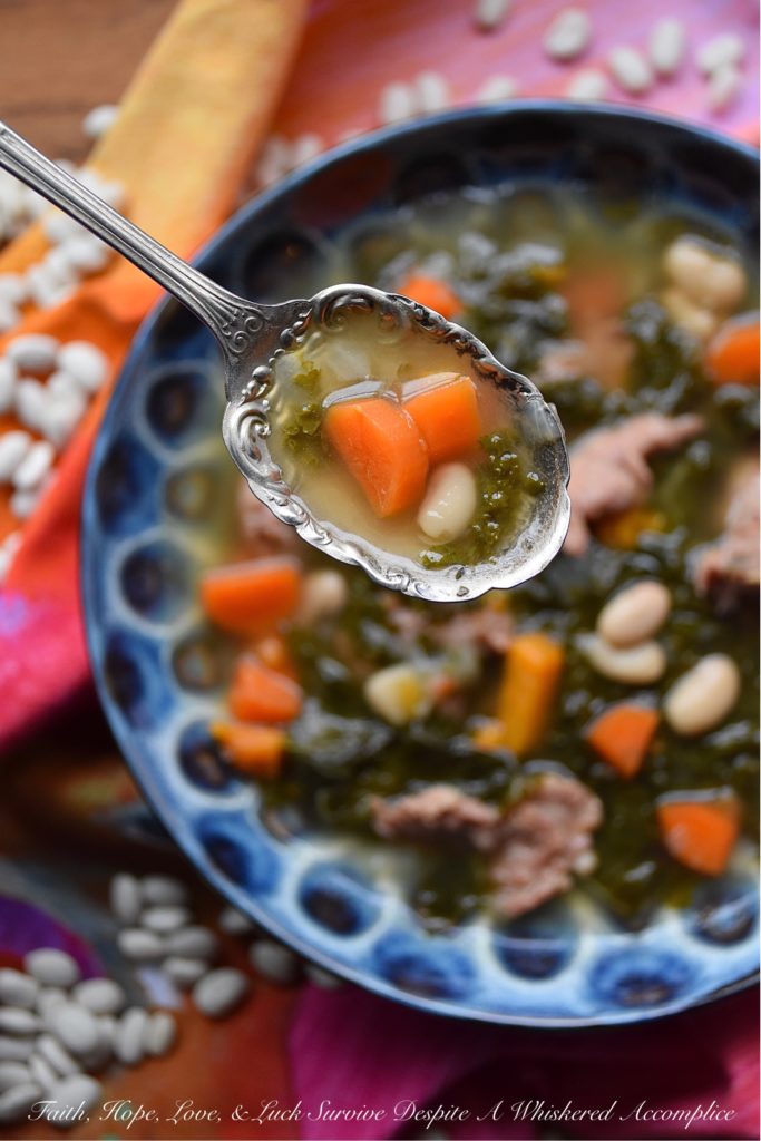 One-Pot Italian Sausage, Kale, & Bean Soup - There's nothing better than a healthy, comforting, and absolutely delicious bowl of soup on a cold winter's day. And, when you make that soup using only one pot, things get even better. This one-pot soup, made with Italian sausage, kale, & beans, will easily become one of your go-to winter soup recipes.