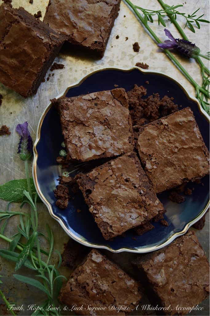 Dark Chocolate Irish Cream Brownies - There's absolutely nothing wrong with a homemade chocolaty fudge brownie. However, sometimes you just need to switch things up and add a boozy little twist to make things even better. These particular dark chocolate brownies have just the right amount of Irish cream to make them simply irresistible. So, grab that bottle of Baileys, and let's get baking.