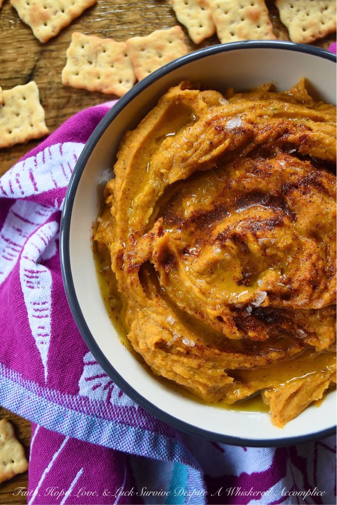 Lemony Chili Roasted Sweet Potato Hummus - Looking for a healthy appetizer recipe with tons of flavor? Instead of snacking on traditional garbanzo bean or chickpea hummus, why not liven it up with the addition of a roasted sweet potato? A little bit of chili powder and fresh lemon juice help to balance everything out, with just a touch of honey for sweetness. You'll definitely love dipping crackers, bread, or even fresh vegetables into this delicious lemony hummus.