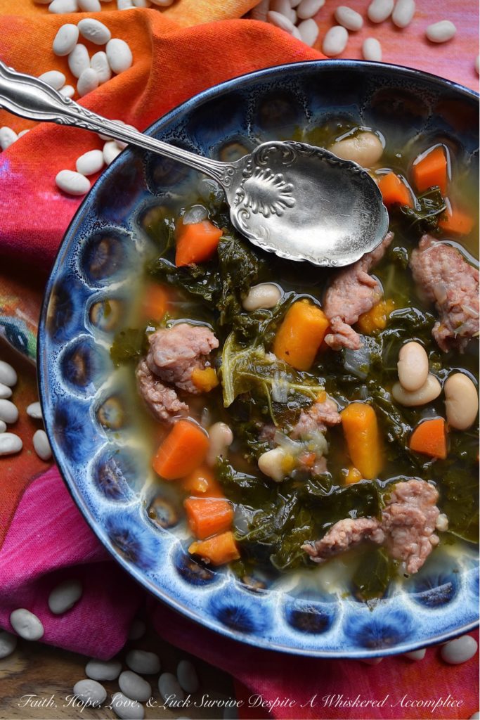 One-Pot Italian Sausage, Kale, & Bean Soup - There's nothing better than a healthy, comforting, and absolutely delicious bowl of soup on a cold winter's day. And, when you make that soup using only one pot, things get even better. This one-pot soup, made with Italian sausage, kale, & beans, will easily become one of your go-to winter soup recipes.
