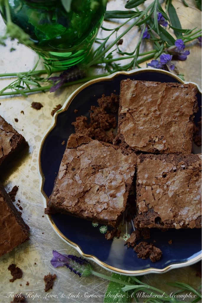 Dark Chocolate Irish Cream Brownies - There's absolutely nothing wrong with a homemade chocolaty fudge brownie. However, sometimes you just need to switch things up and add a boozy little twist to make things even better. These particular dark chocolate brownies have just the right amount of Irish cream to make them simply irresistible. So, grab that bottle of Baileys, and let's get baking.