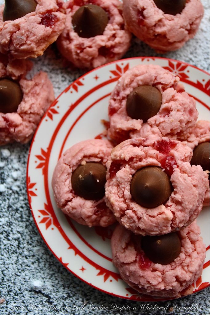 Vanilla Bean Cherry Chocolate Kiss Cookies - Looking for a sweet festive cookie to share with your loved one this Valentine's Day? These maraschino cherry cookies contain not just vanilla extract but also the seeds from two vanilla bean pods, making them a vanilla lover's dream come true. Add a chocolate kiss on top of each cookie for the ultimate treat to show your sweetheart just how much you love them.
