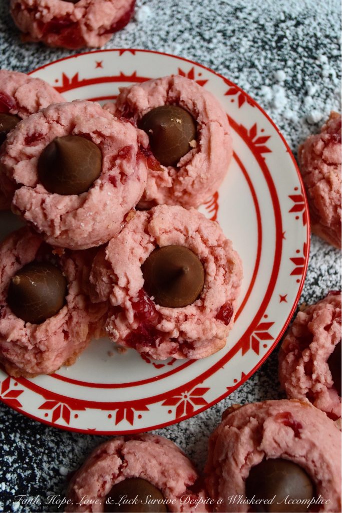 Vanilla Bean Cherry Chocolate Kiss Cookies - Looking for a sweet festive cookie to share with your loved one this Valentine's Day? These maraschino cherry cookies contain not just vanilla extract but also the seeds from two vanilla bean pods, making them a vanilla lover's dream come true. Add a chocolate kiss on top of each cookie for the ultimate treat to show your sweetheart just how much you love them.