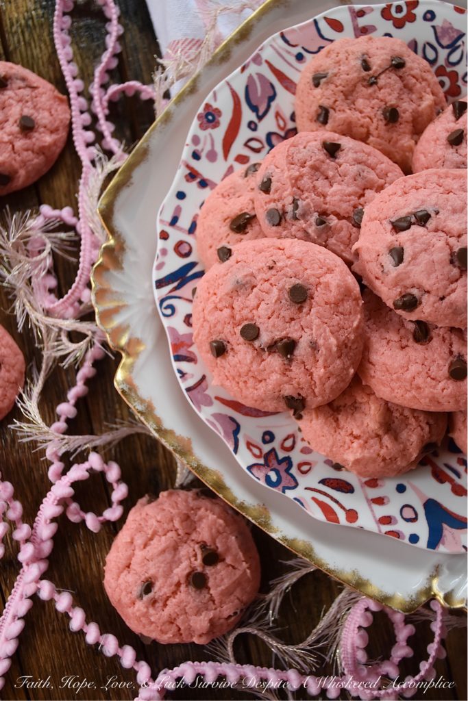 Chocolate Chip Strawberry Cake Mix Cookies - Baking up a batch of deliciously sweet cookies for your sweetheart doesn't always mean that you need to spend a lot of time in the kitchen or dirty a ton of dishes. With these chocolate chip strawberry cookies, you'll just need a mixing bowl, a strawberry cake mix, and five common household baking ingredients. This Valentine's Day, show that special person in your life just how much you love them with a batch of these easy-to-make cake mix cookies.