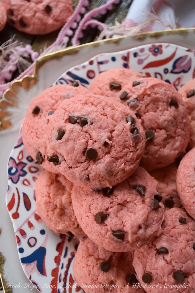 Chocolate Chip Strawberry Cake Mix Cookies - Baking up a batch of deliciously sweet cookies for your sweetheart doesn't always mean that you need to spend a lot of time in the kitchen or dirty a ton of dishes. With these chocolate chip strawberry cookies, you'll just need a mixing bowl, a strawberry cake mix, and five common household baking ingredients. This Valentine's Day, show that special person in your life just how much you love them with a batch of these easy-to-make cake mix cookies.