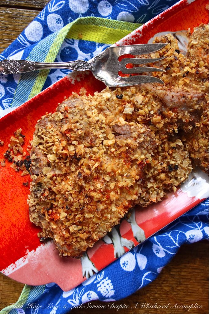 Tortilla Crusted Baked Marinated Pork Chops - We're all looking for a baked pork chop recipe with great flavor. However, more often than not, baked pork chops tend to be dry, rubbery, and disappointing. With this tortilla-crusted marinated pork chop recipe, that won't be a problem. Thanks to the simple overnight marinade, these pork chops come out of the oven super juicy and flavorful. And, the tortilla crust makes them even more amazing.