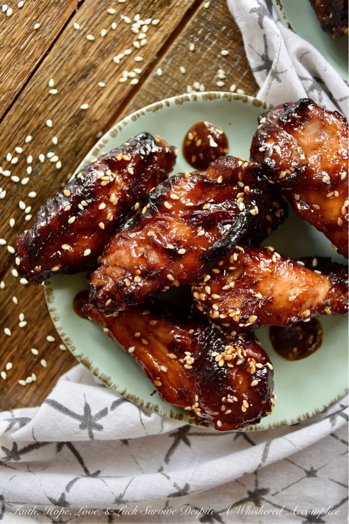Sticky Asian Baked Chicken Wings with Honey - Game days, parties, and gatherings all have one thing in common; they are all better with chicken wings. Especially, if those chicken wings are marinated, baked, and then served in a sticky Asian sauce made with honey. Sure, they might be a little bit messy to eat, but they are well worth getting your hands dirty. Just remember to grab an extra napkin or two.