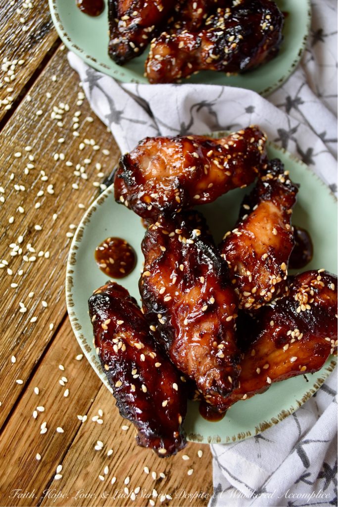 Sticky Asian Baked Chicken Wings with Honey - Game days, parties, and gatherings all have one thing in common; they are all better with chicken wings. Especially, if those chicken wings are marinated, baked, and then served in a sticky Asian sauce made with honey. Sure, they might be a little bit messy to eat, but they are well worth getting your hands dirty. Just remember to grab an extra napkin or two.