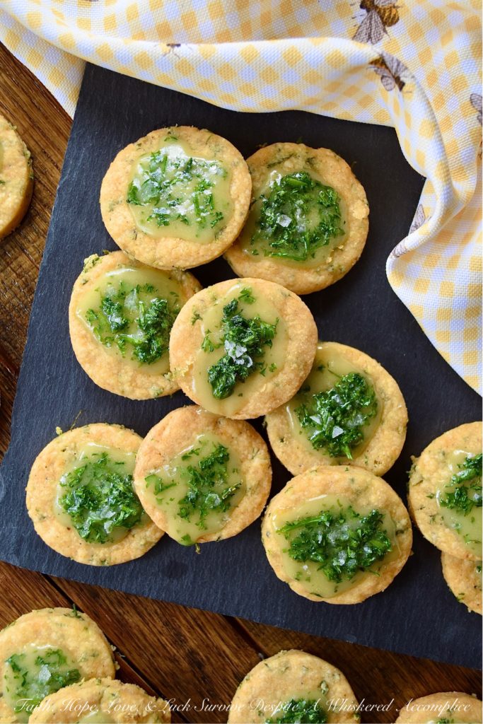 Honey-Kissed Savory Shortbread Crackers - It may seem like a lot of work to make homemade crackers when you can just pick some up at your local market. However, after you've tasted one of these sweet and savory honey-kissed shortbread crackers, I think you'll admit that it's worth every minute of time you spent baking them. They're crispy, cheesy, salty, and have a lovely sweet honey finish. They are basically cracker perfection.