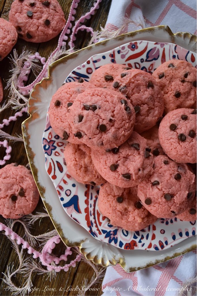 Chocolate Chip Strawberry Cake Mix Cookies - Baking up a batch of deliciously sweet cookies for your sweetheart doesn't always mean that you need to spend a lot of time in the kitchen or dirty a ton of dishes. With these chocolate chip strawberry cookies, you'll just need a mixing bowl, a strawberry cake mix, and five common household baking ingredients. This Valentine's Day, show that special person in your life just how much you love them with a batch of these easy-to-make cake mix cookies.