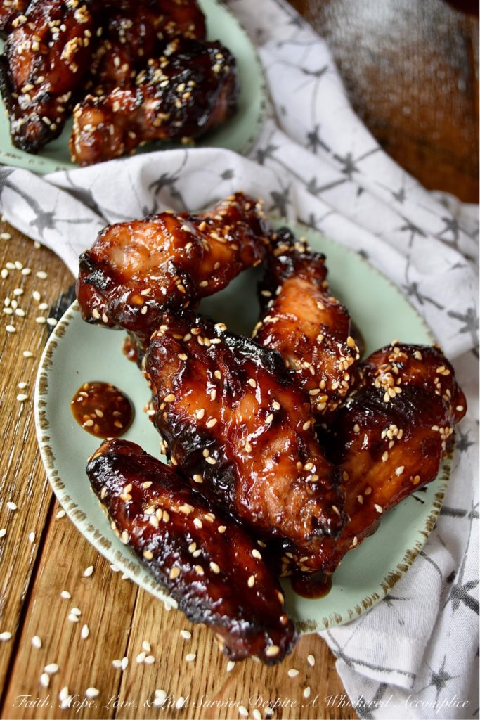 Sticky Asian Baked Chicken Wings with Honey - Game days, parties, and gatherings all have one thing in common; they are all better with chicken wings. Especially, if those chicken wings are marinated, baked, and then served in a sticky Asian sauce made with honey. Sure, they might be a little bit messy to eat, but they are well worth getting your hands dirty. Just remember to grab an extra napkin or two.