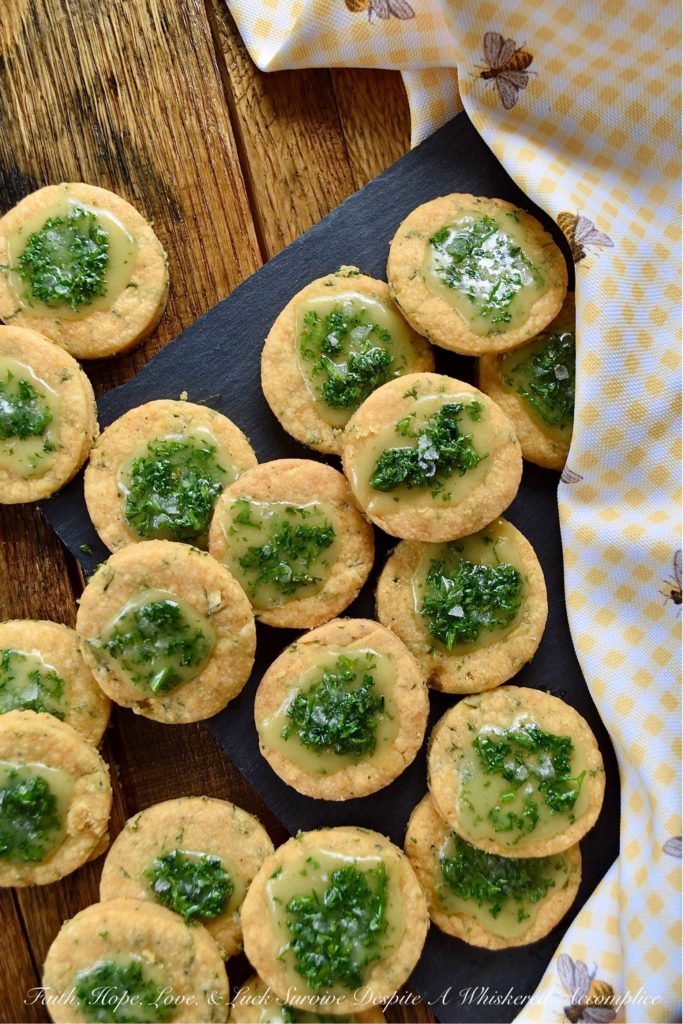 Honey-Kissed Savory Shortbread Crackers - It may seem like a lot of work to make homemade crackers when you can just pick some up at your local market. However, after you've tasted one of these sweet and savory honey-kissed shortbread crackers, I think you'll admit that it's worth every minute of time you spent baking them. They're crispy, cheesy, salty, and have a lovely sweet honey finish. They are basically cracker perfection.