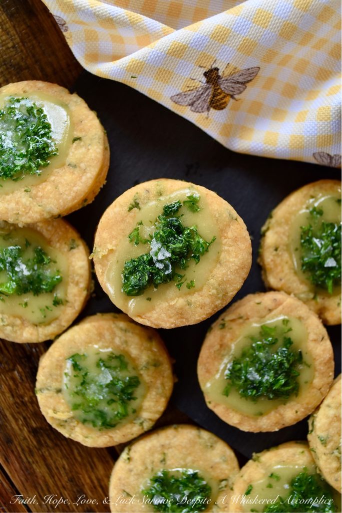 Honey-Kissed Savory Shortbread Crackers - It may seem like a lot of work to make homemade crackers when you can just pick some up at your local market. However, after you've tasted one of these sweet and savory honey-kissed shortbread crackers, I think you'll admit that it's worth every minute of time you spent baking them. They're crispy, cheesy, salty, and have a lovely sweet honey finish. They are basically cracker perfection.