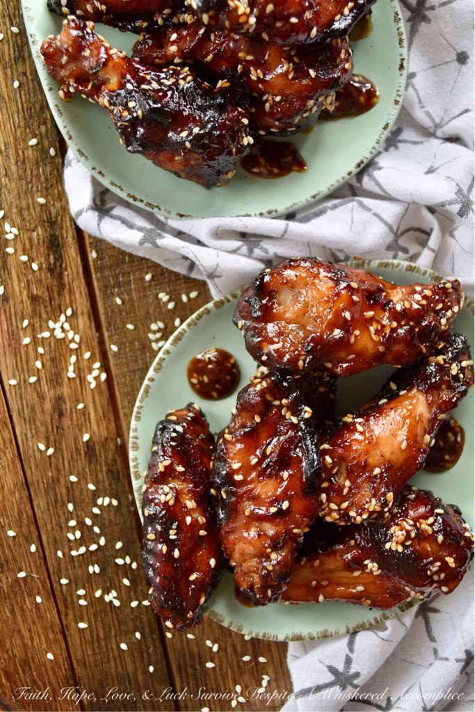Sticky Asian Baked Chicken Wings with Honey - Game days, parties, and gatherings all have one thing in common; they are all better with chicken wings. Especially, if those chicken wings are marinated, baked, and then served in a sticky Asian sauce made with honey. Sure, they might be a little bit messy to eat, but they are well worth getting your hands dirty. Just remember to grab an extra napkin or two.