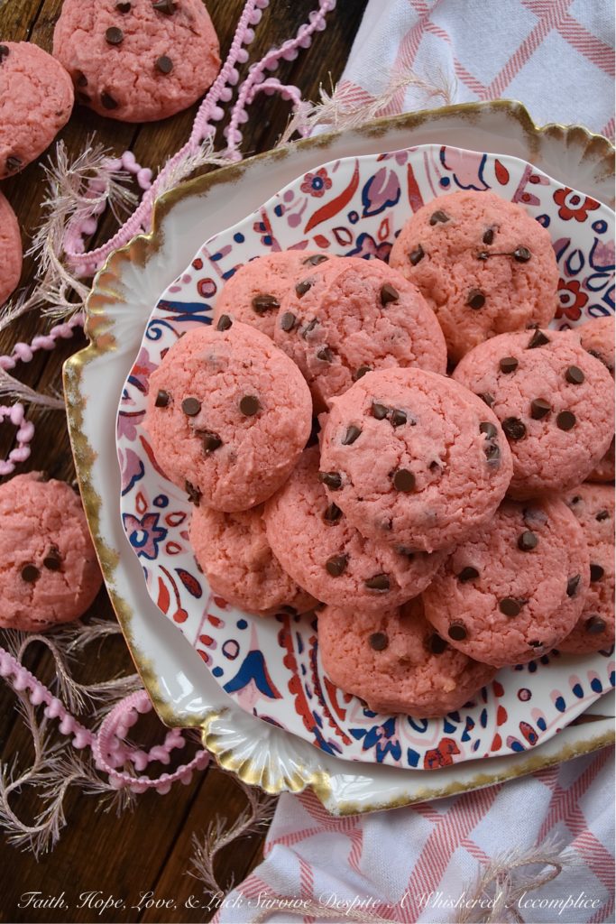 Chocolate Chip Strawberry Cake Mix Cookies - Baking up a batch of deliciously sweet cookies for your sweetheart doesn't always mean that you need to spend a lot of time in the kitchen or dirty a ton of dishes. With these chocolate chip strawberry cookies, you'll just need a mixing bowl, a strawberry cake mix, and five common household baking ingredients. This Valentine's Day, show that special person in your life just how much you love them with a batch of these easy-to-make cake mix cookies.