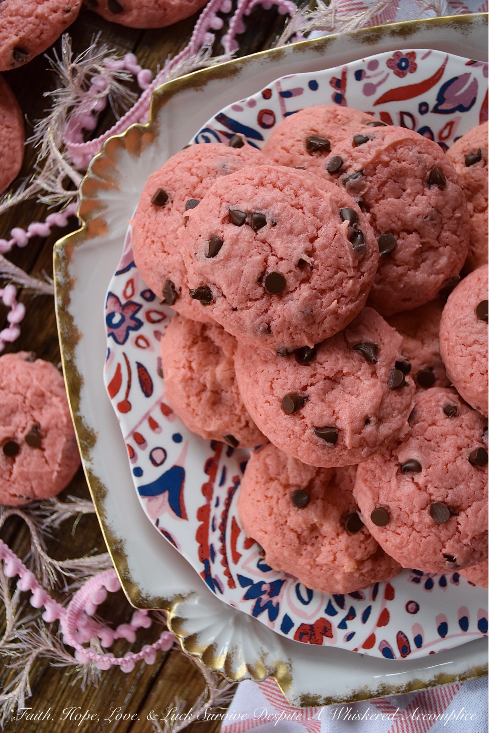 Chocolate Chip Strawberry Cake Mix Cookies - Baking up a batch of deliciously sweet cookies for your sweetheart doesn't always mean that you need to spend a lot of time in the kitchen or dirty a ton of dishes. With these chocolate chip strawberry cookies, you'll just need a mixing bowl, a strawberry cake mix, and five common household baking ingredients. This Valentine's Day, show that special person in your life just how much you love them with a batch of these easy-to-make cake mix cookies.