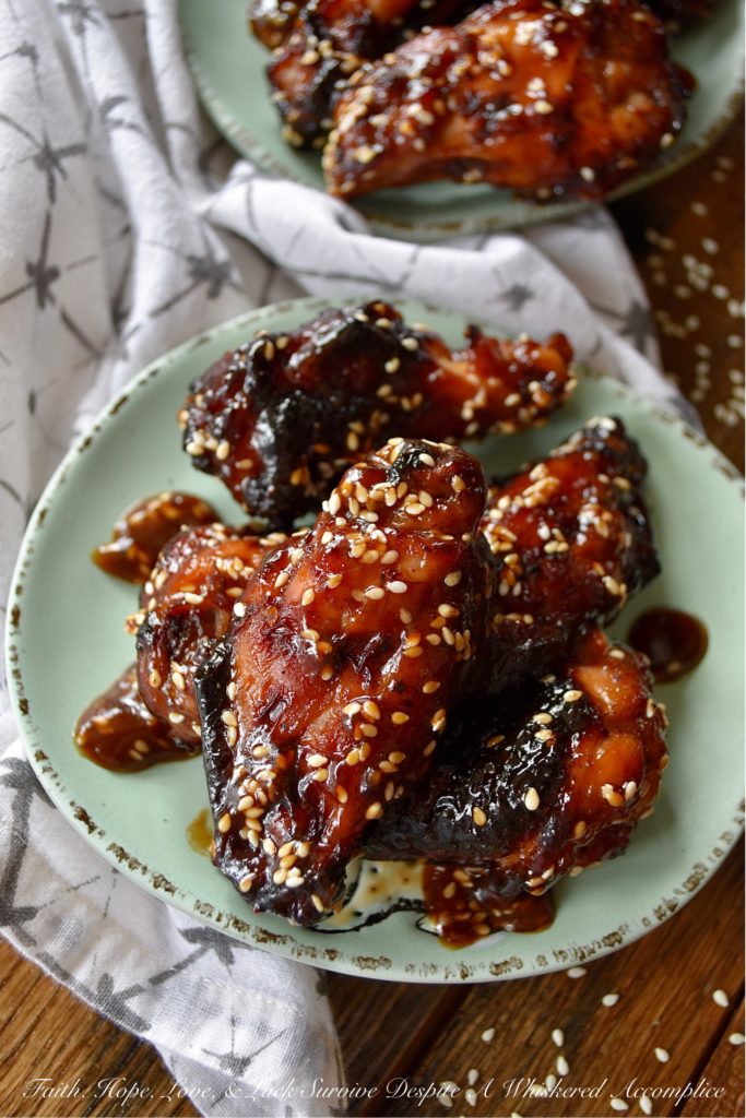 Sticky Asian Baked Chicken Wings with Honey - Game days, parties, and gatherings all have one thing in common; they are all better with chicken wings. Especially, if those chicken wings are marinated, baked, and then served in a sticky Asian sauce made with honey. Sure, they might be a little bit messy to eat, but they are well worth getting your hands dirty. Just remember to grab an extra napkin or two.