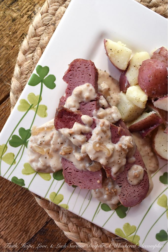 Crockpot Corned Beef with Stout & Onion Gravy - Are you looking for a new recipe to help you celebrate St. Patrick's Day? A recipe that can be made in a crockpot? Say hello to your new favorite way to cook corned beef. After the corned beef brisket slowly cooks for several hours in a crockpot, you use the crockpot cooking liquid and the strained crockpot ingredients to make a quick, simple, easy, and absolutely delicious creamy stout and onion gravy. Get ready to have your shamrocks rocked by this amazing gravy-smothered crockpot corned beef.