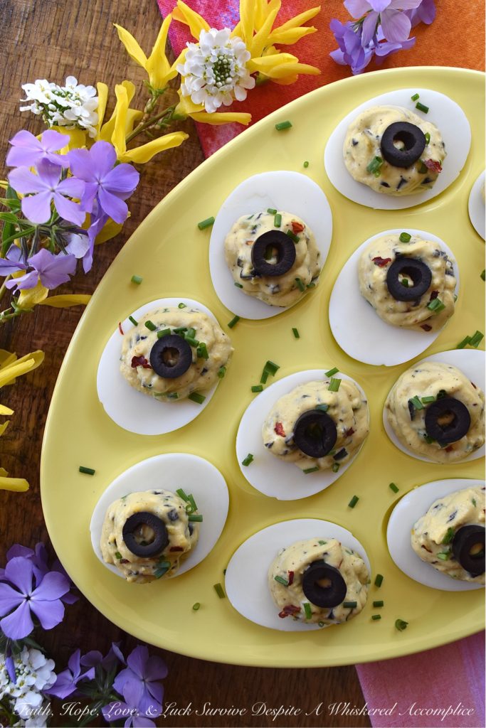 Chunky Sweet & Spicy Black Olive Deviled Eggs - Most deviled eggs have a creamy filling, however, with these deviled eggs, finely chopped black olives give the deviled egg filling a delightful chunky texture. And, once you add a little dijon mustard, honey, crushed red pepper flakes, black pepper, chives, and mayonnaise, I think you'll be quite impressed with the lovely sweet and spicy flavor of these chunky black olive deviled eggs.