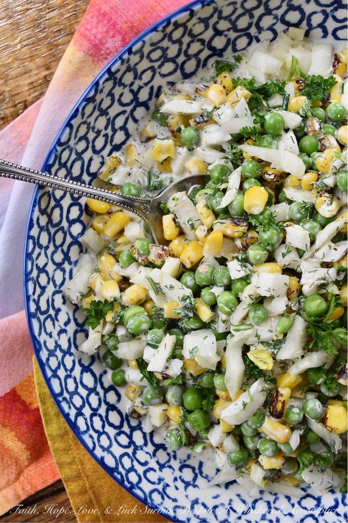 Buttermilk Corn, Pea, & Fennel Ranch Salad - Fresh vegetables aren't always available when it comes to making a creamy, well-seasoned, crunchy vegetable side dish. So, with this buttermilk ranch salad, frozen vegetables come to the rescue. Perfectly cooked frozen corn and peas are mixed with a homemade herby buttermilk dressing. Then, a chopped bulb of fennel is added to create just the right amount of crunch and flavor to make this salad one of the most delicious frozen vegetable side dishes you'll ever taste.