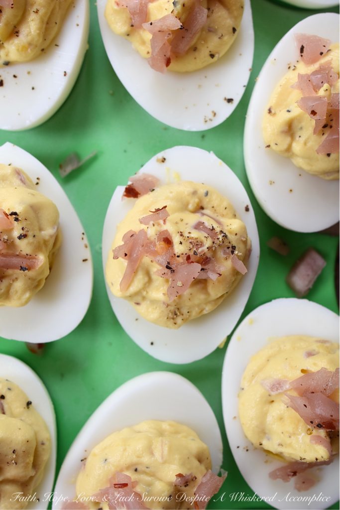 Black Pepper & Pickled Red Onion Deviled Eggs - What happens when you add pickled red onions to a traditional deviled egg recipe? The result is a delicious deviled egg with a sweet, tangy, and bright oniony flavor. These deviled eggs are a must-try, especially if you're the type of person who tends to avoid recipes calling for uncooked onions. I'm fairly certain that these black pepper and pickled red onion-filled deviled eggs will most definitely win your taste buds over.