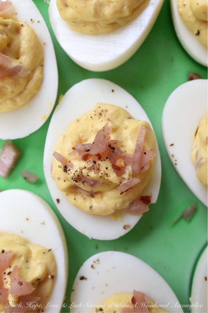 Black Pepper & Pickled Red Onion Deviled Eggs - What happens when you add pickled red onions to a traditional deviled egg recipe? The result is a delicious deviled egg with a sweet, tangy, and bright oniony flavor. These deviled eggs are a must-try, especially if you're the type of person who tends to avoid recipes calling for uncooked onions. I'm fairly certain that these black pepper and pickled red onion-filled deviled eggs will most definitely win your taste buds over.