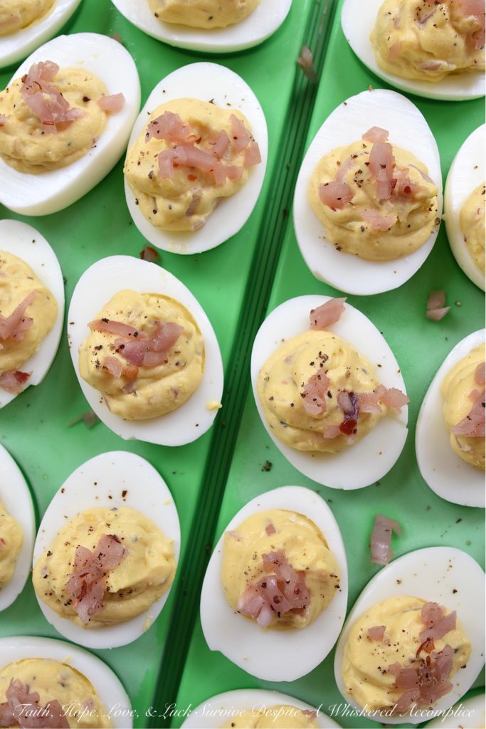 Black Pepper & Pickled Red Onion Deviled Eggs - What happens when you add pickled red onions to a traditional deviled egg recipe? The result is a delicious deviled egg with a sweet, tangy, and bright oniony flavor. These deviled eggs are a must-try, especially if you're the type of person who tends to avoid recipes calling for uncooked onions. I'm fairly certain that these black pepper and pickled red onion-filled deviled eggs will most definitely win your taste buds over.