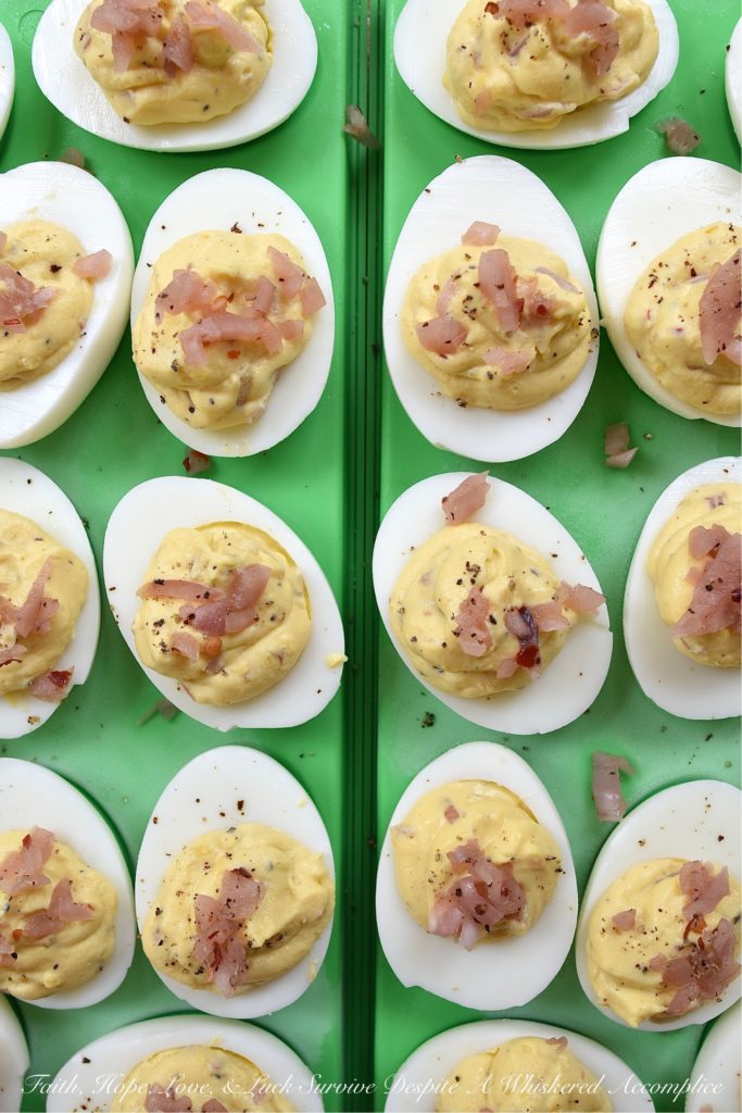 Black Pepper & Pickled Red Onion Deviled Eggs - What happens when you add pickled red onions to a traditional deviled egg recipe? The result is a delicious deviled egg with a sweet, tangy, and bright oniony flavor. These deviled eggs are a must-try, especially if you're the type of person who tends to avoid recipes calling for uncooked onions. I'm fairly certain that these black pepper and pickled red onion-filled deviled eggs will most definitely win your taste buds over.